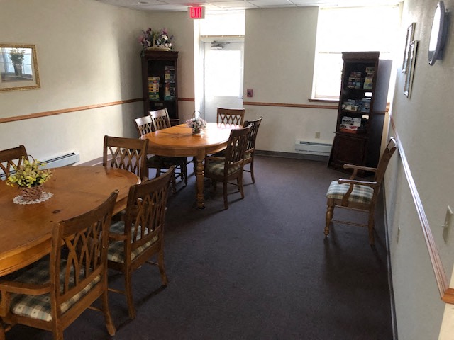 a dining room with a table and chairs